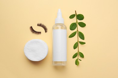 Photo of Flat lay composition with makeup remover and false eyelashes on yellow background