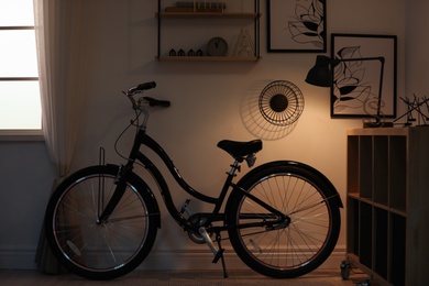 Photo of Stylish room with modern bicycle. Idea for interior decor
