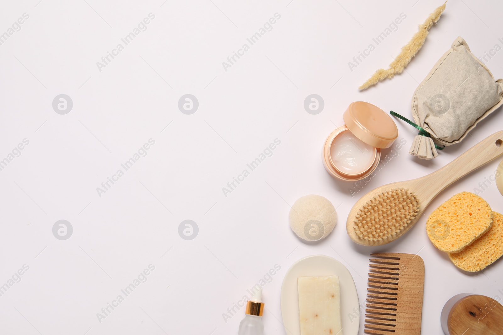 Photo of Bath accessories. Different personal care products and dry spikelet on white background, flat lay with space for text