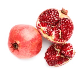 Photo of Whole and pieces of fresh pomegranates isolated on white, top view