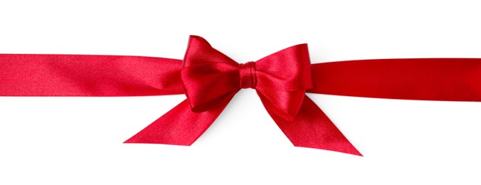 Photo of Red satin ribbon with bow on white background, top view