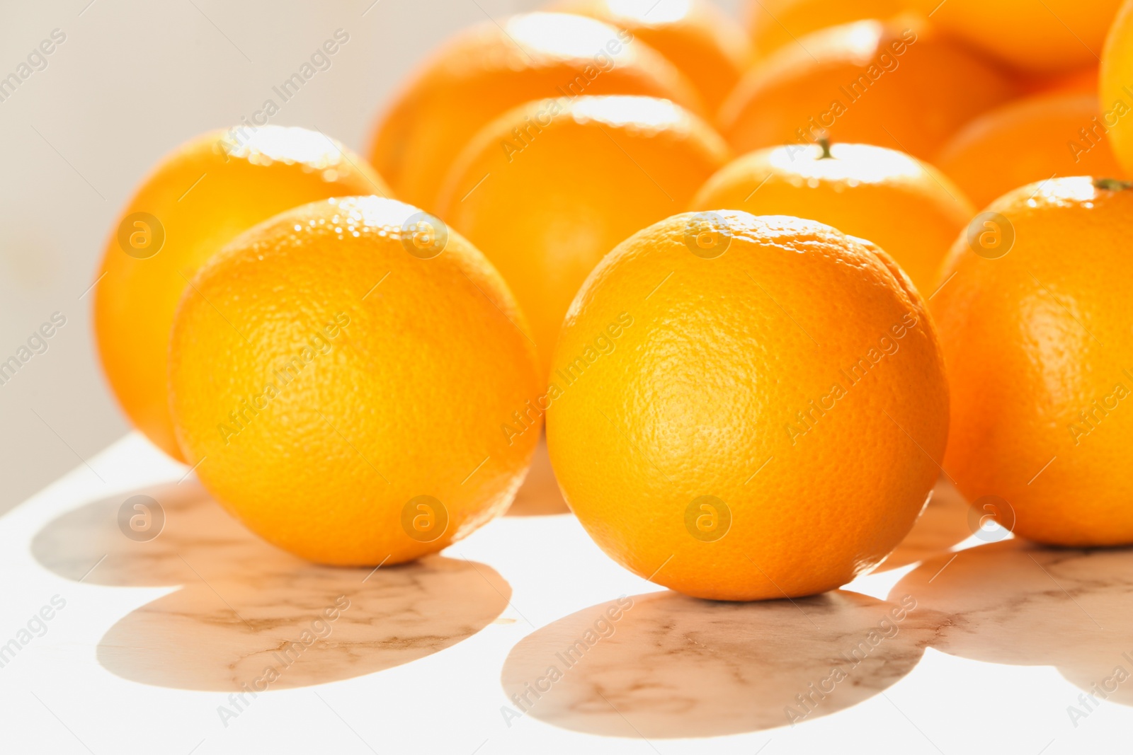 Photo of Fresh juicy oranges on table, closeup. Healthy fruits