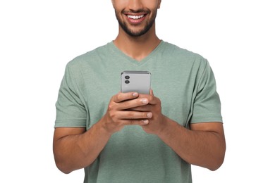 Man sending message via smartphone on white background, closeup