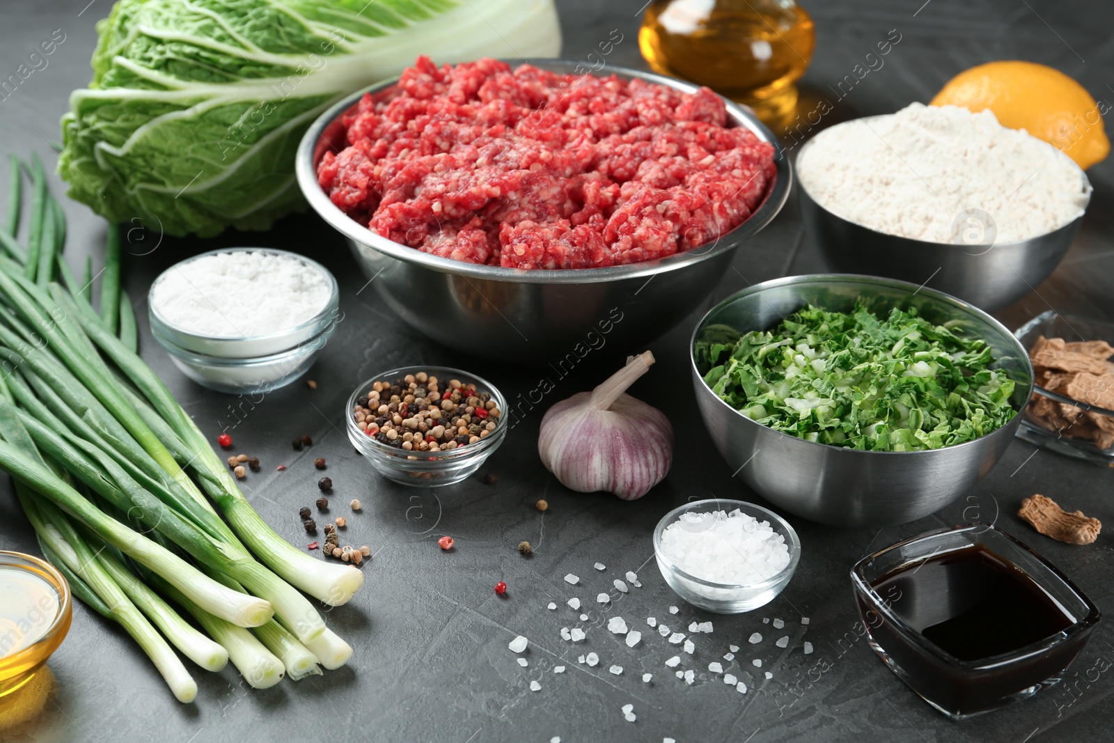 Photo of Composition with ingredients for gyoza on black table