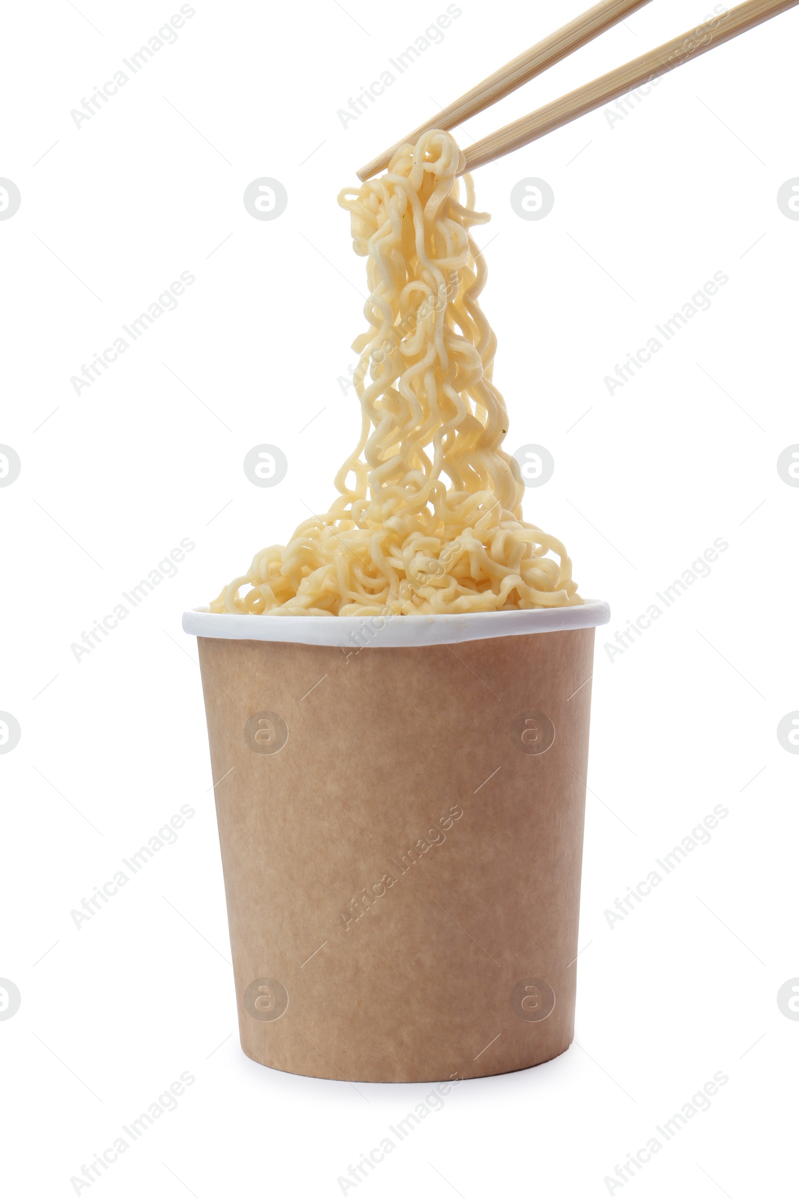 Photo of Paper cup of instant noodles and chopsticks isolated on white. Mockup for design