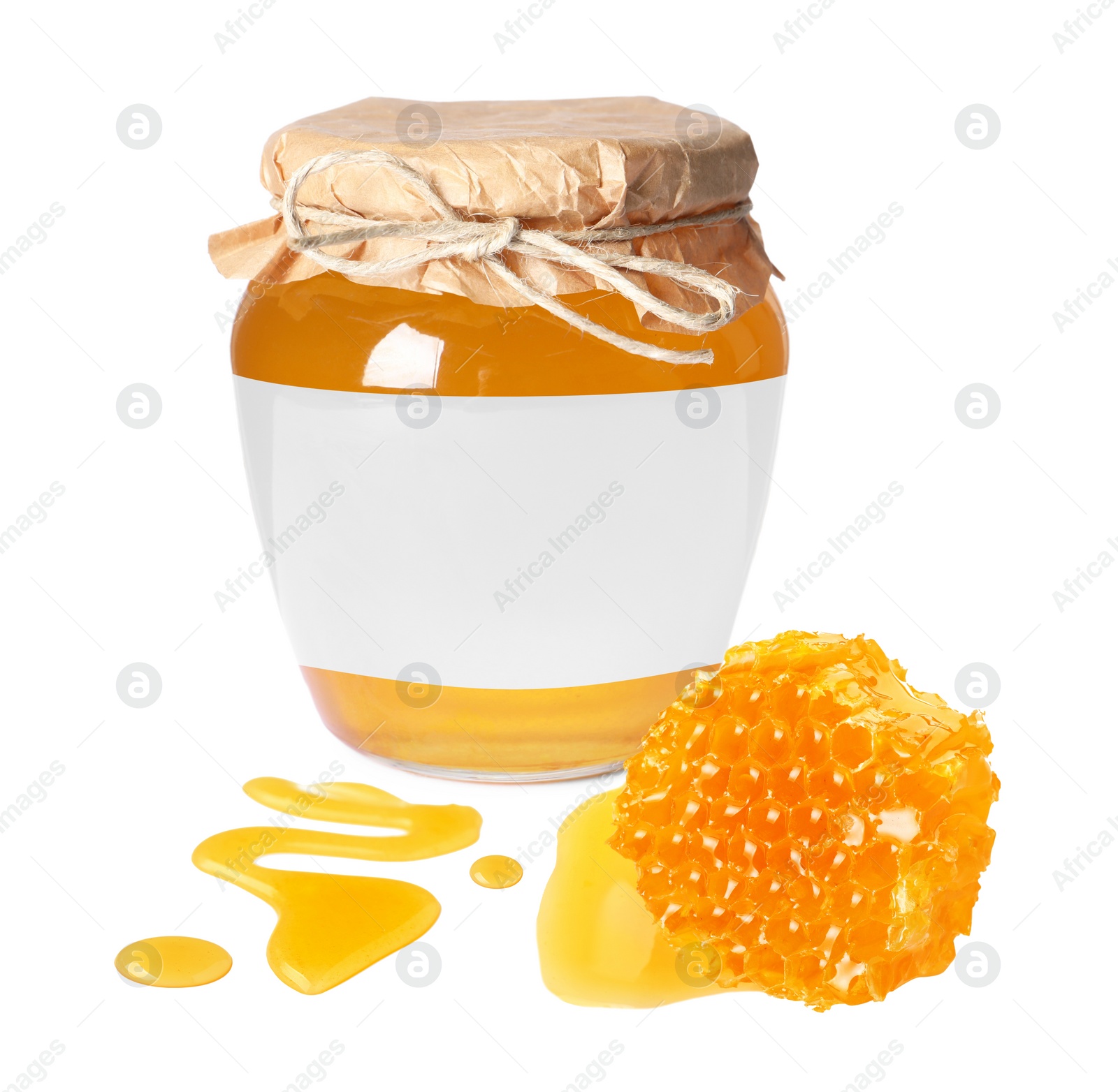 Image of Sweet honey in glass jar with blank label and piece of honeycomb on white background. Mockup for design