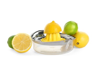 Photo of Metal juicer, fresh lime and lemons on white background
