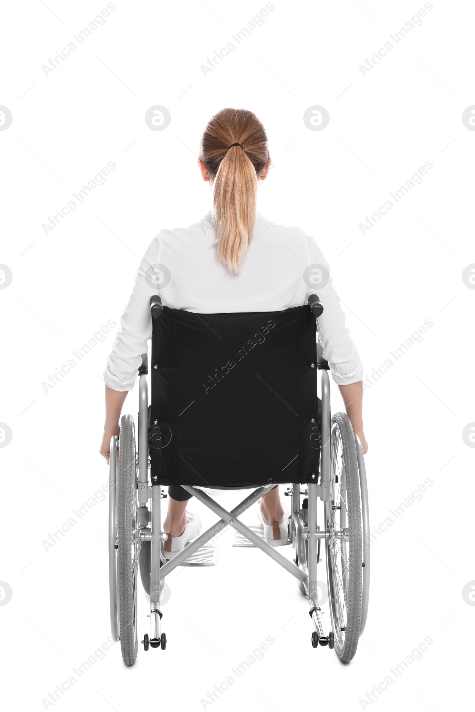 Photo of Young woman in wheelchair isolated on white, back view