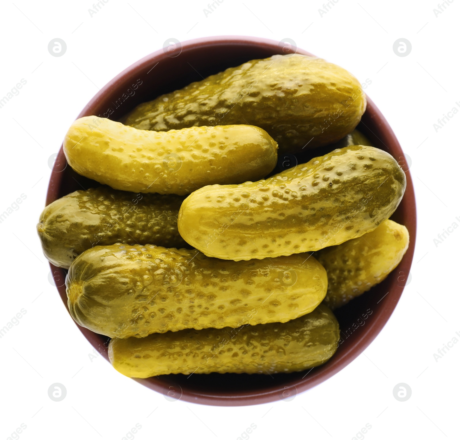 Photo of Bowl of tasty pickled cucumbers isolated on white, top view