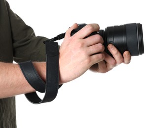 Photographer holding modern camera on white background, closeup