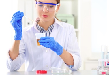 Photo of Female scientist working in laboratory. Research and analysis