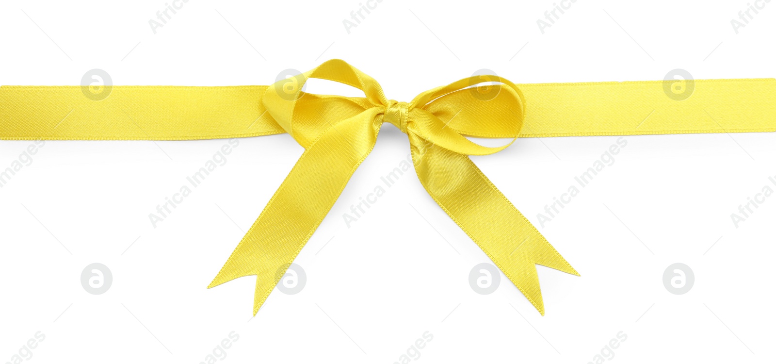 Photo of Yellow satin ribbon with bow on white background, top view