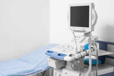 Photo of Ultrasound machine and examination table in hospital