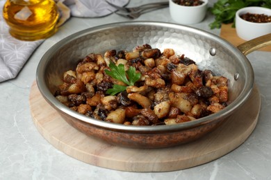 Tasty fried cracklings on light table. Cooked pork lard