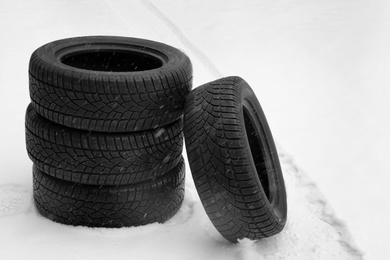 New winter tires on fresh snow outdoors