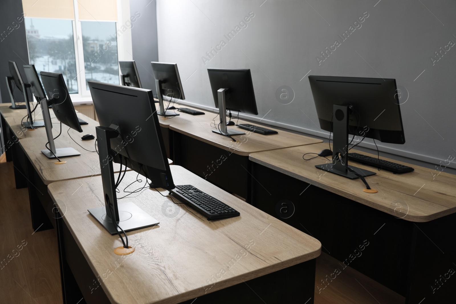 Photo of Many modern computers in open space office