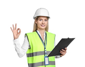 Photo of Engineer in hard hat holding clipboard and showing ok gesture on white background