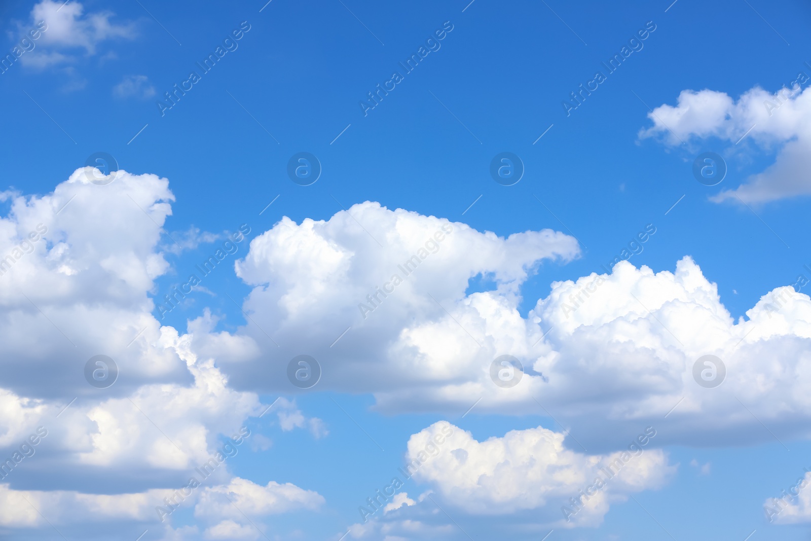 Photo of Beautiful white fluffy clouds in blue sky