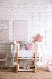 Photo of Baby room interior with toys and stylish furniture