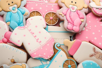 Photo of Cute tasty cookies of different shapes, top view. Baby shower party