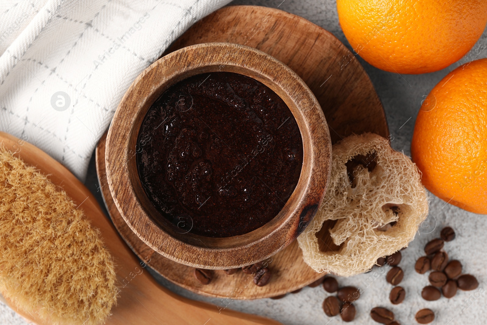 Photo of Flat lay composition with natural body scrub and fresh ingredients on beige textured table. Anti cellulite treatment