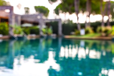 Blurred view of outdoor swimming pool at luxury resort