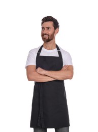 Professional hairdresser wearing apron with crossed arms on white background