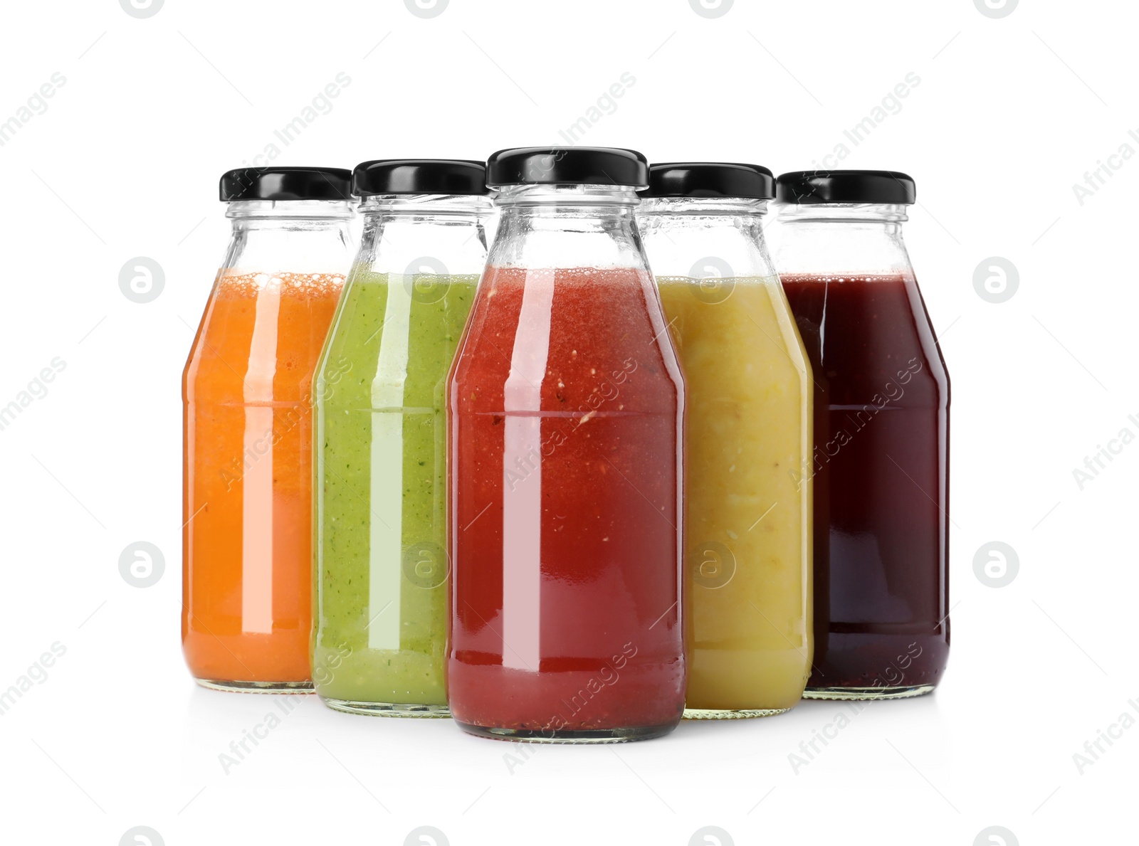 Photo of Bottles of fresh juices on white background