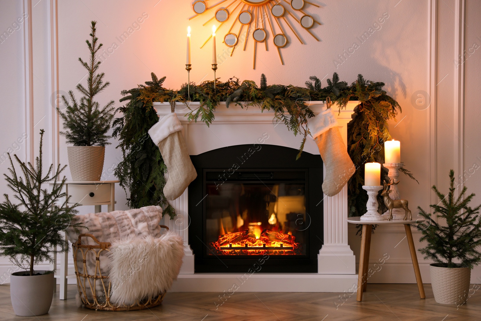 Photo of Stylish room interior with fireplace and beautiful Christmas decor