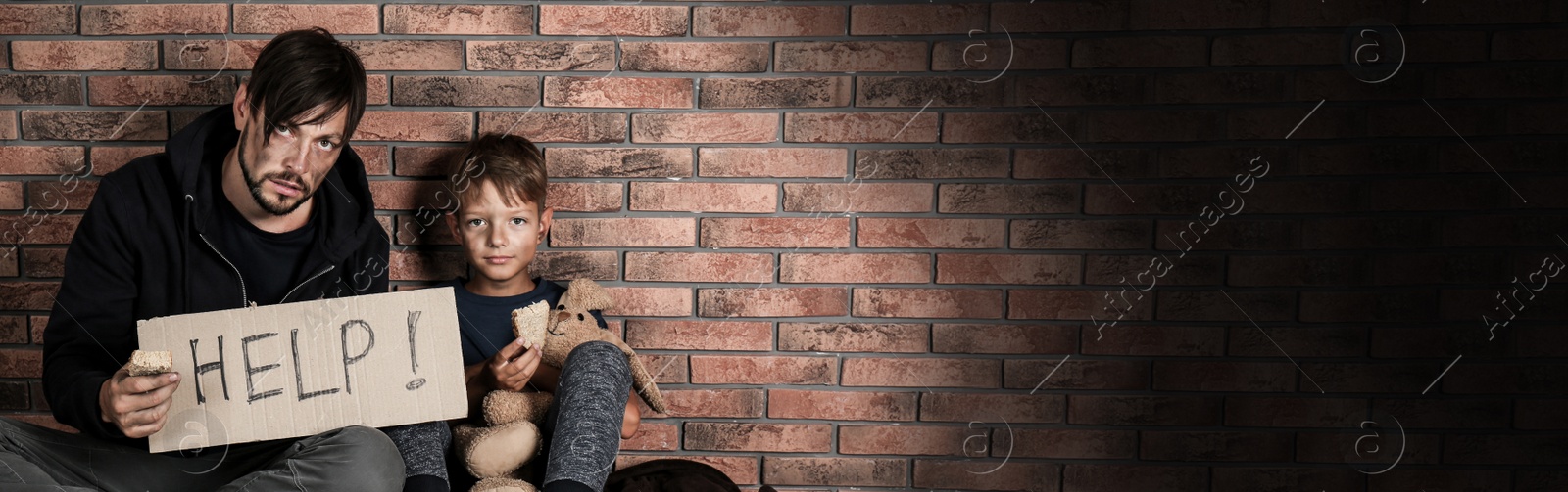 Image of Poor man with his son asking for help near brick wall, space for text. Banner design