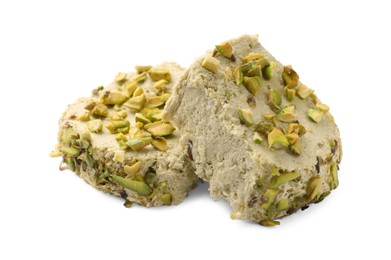 Photo of Pieces of tasty halva with pistachios on white background