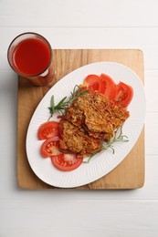 Photo of Tasty fried parsnips with fresh tomatoes and rosemary on white wooden table, top view