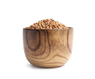 Bowl with uncooked buckwheat on white background