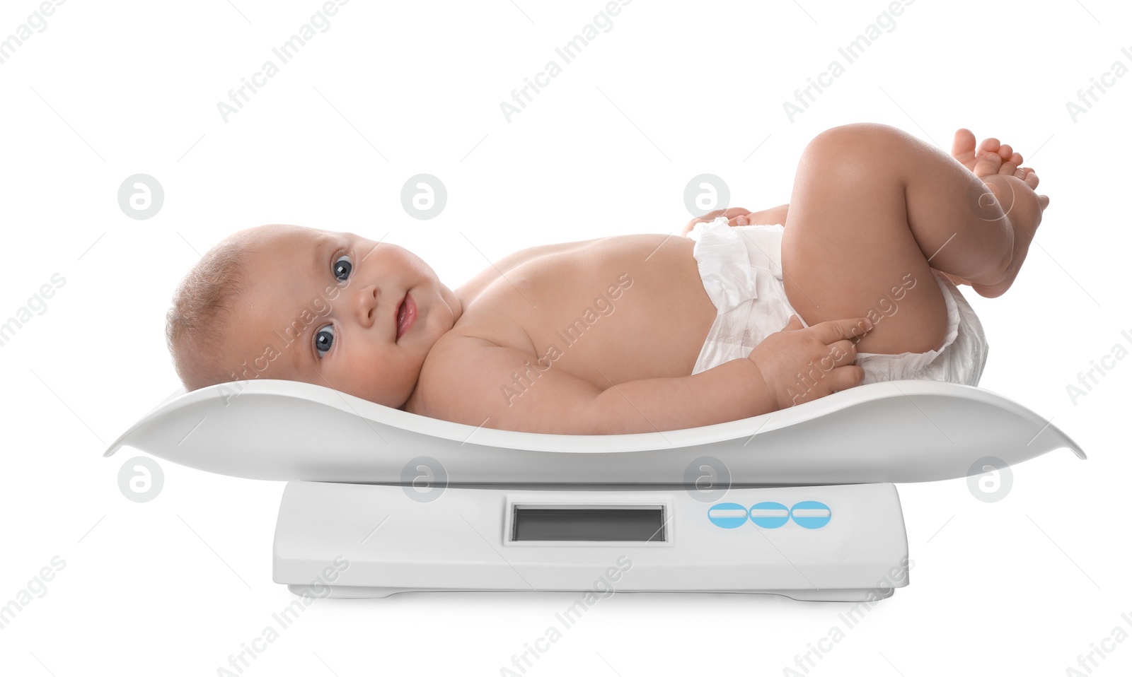 Photo of Cute little baby lying on scales against white background