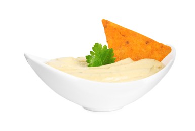Delicious hummus with nacho chip and parsley in bowl isolated on white