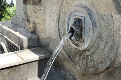 Photo of View of beautiful wall fountain on sunny day