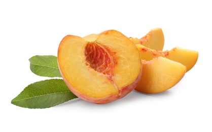Photo of Cut fresh ripe peach with leaves on white background