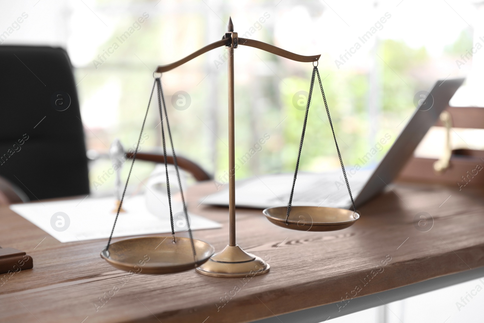 Photo of Scales of justice on desk in notary's office