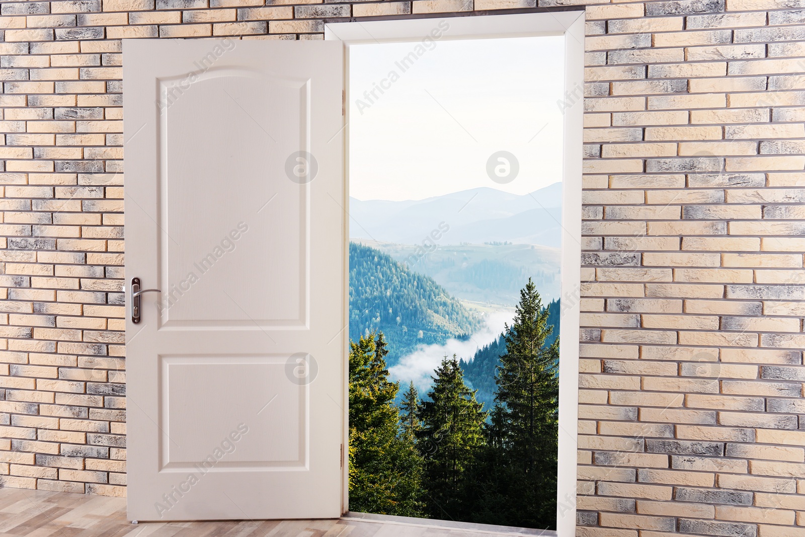 Image of Beautiful mountain landscape visible through open door