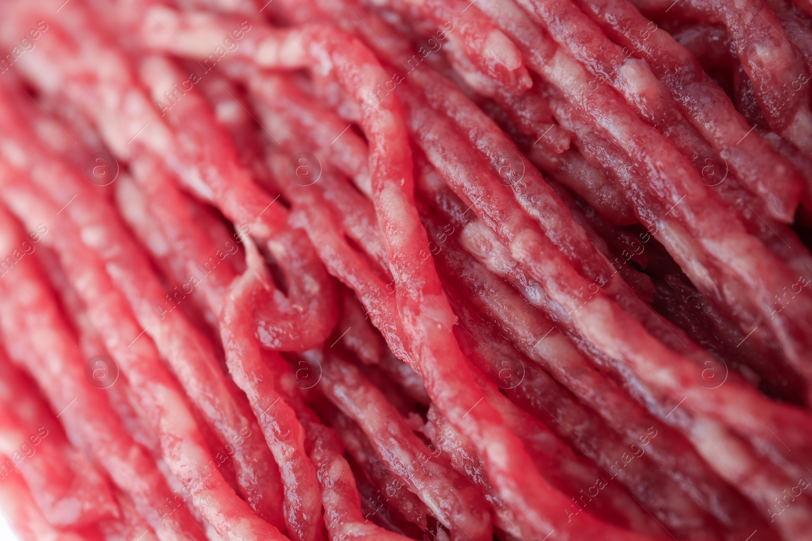 Photo of Fresh raw minced meat as background, closeup