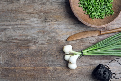 Beautiful composition with fresh green onion on table, top view