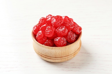 Photo of Bowl with tasty cherries on wooden background. Dried fruits as healthy food