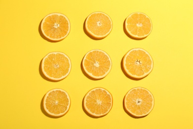 Photo of Flat lay composition with fresh ripe oranges on yellow background