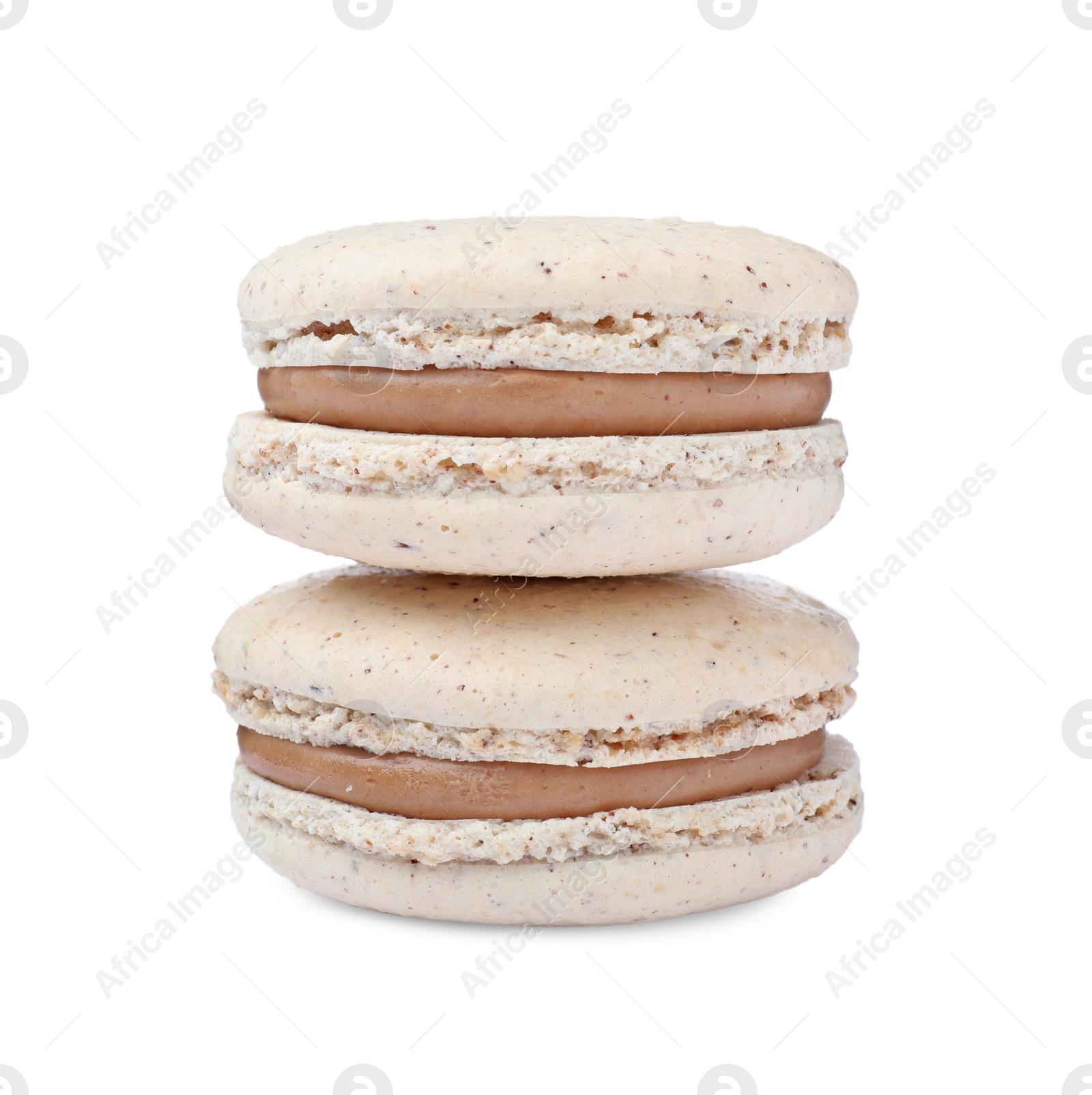 Photo of Beige macarons on white background. Delicious dessert