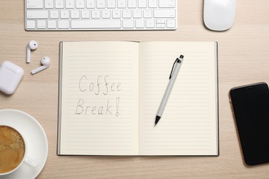 Photo of Workplace with notebook and cup of drink on wooden table, flat lay. Coffee break