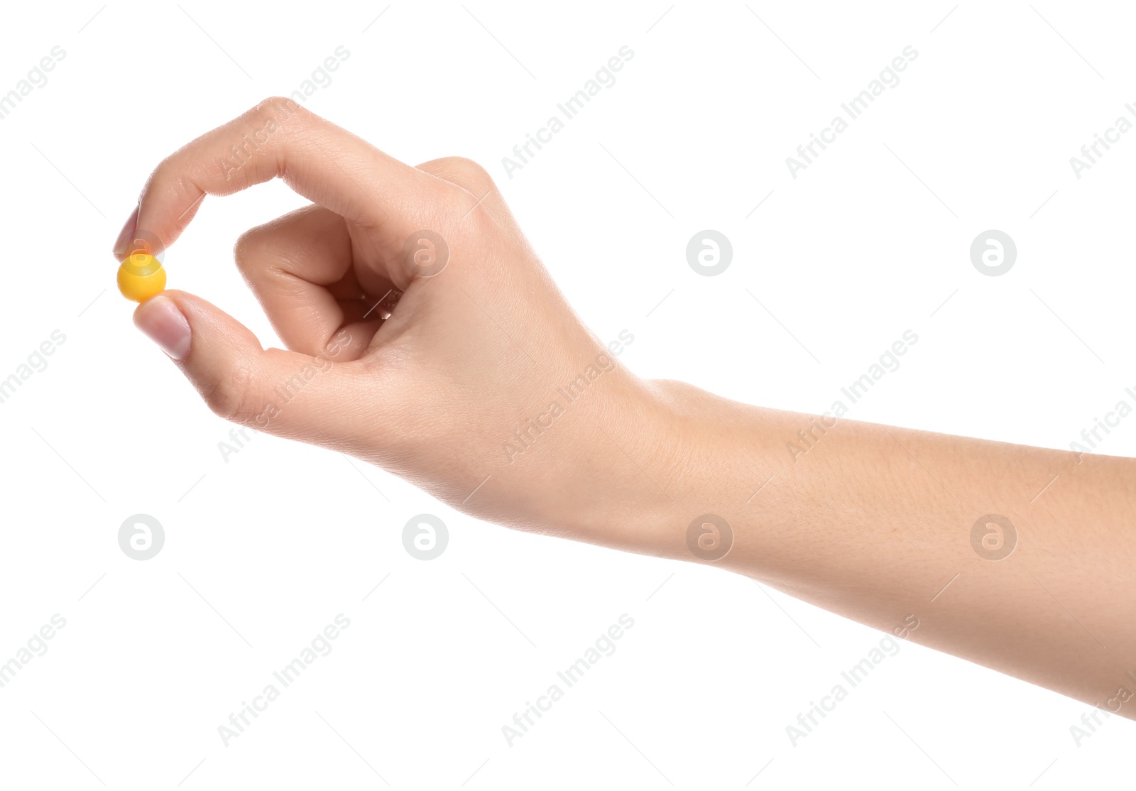 Photo of Woman holding color pill on white background, closeup