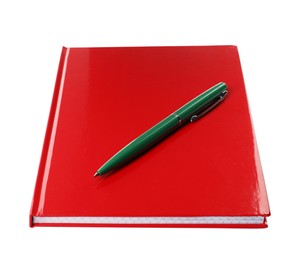 Photo of New red planner with pen isolated on white