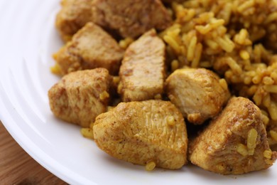 Photo of Delicious chicken with rice on plate, closeup