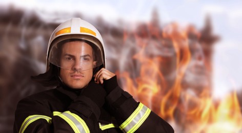 Image of Rescuer wearing uniform and helmet. Professional firefighter