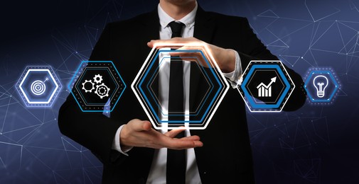 Image of Businessman showing different icons on virtual screen against dark blue background, banner design